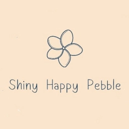 Logo van Shiny Happy Pebble